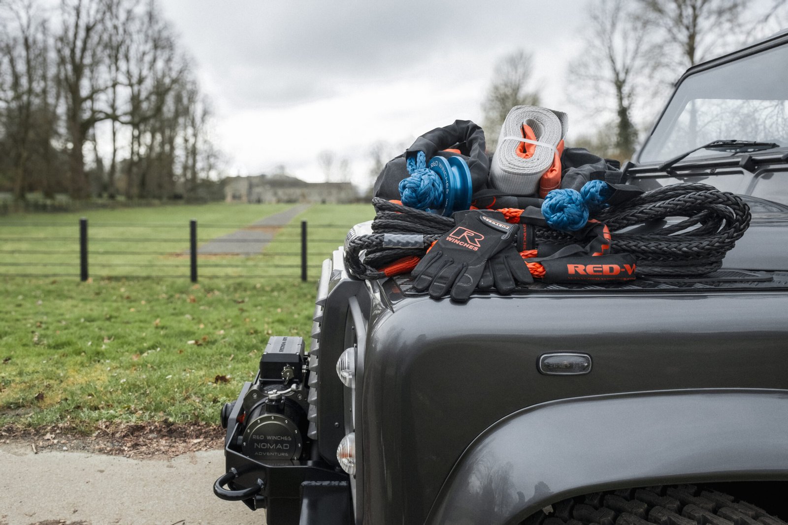Black Land Rover Defender with a recovery kit from RED Winches for recoveries in Somerset woodland track