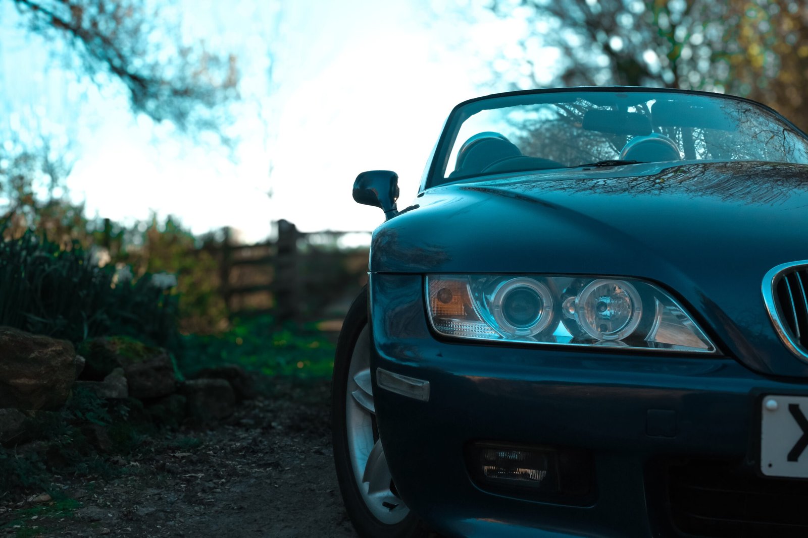 Land Rover Defender parked in Somerset on a woodland track